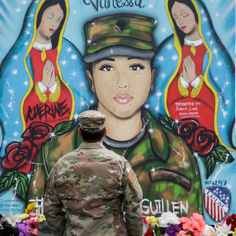 First Lieutenant Spencer Daulisa pays his respects