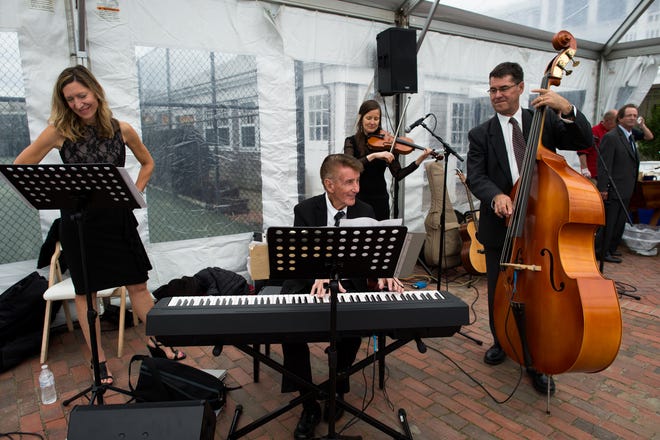 The Kaizer family performs during a family wedding. At left is Ed’s daughter-in-law Lynn, in the background is Ed’s daughter Laraine playing violin, and his son Ed Jr. is on the right.
