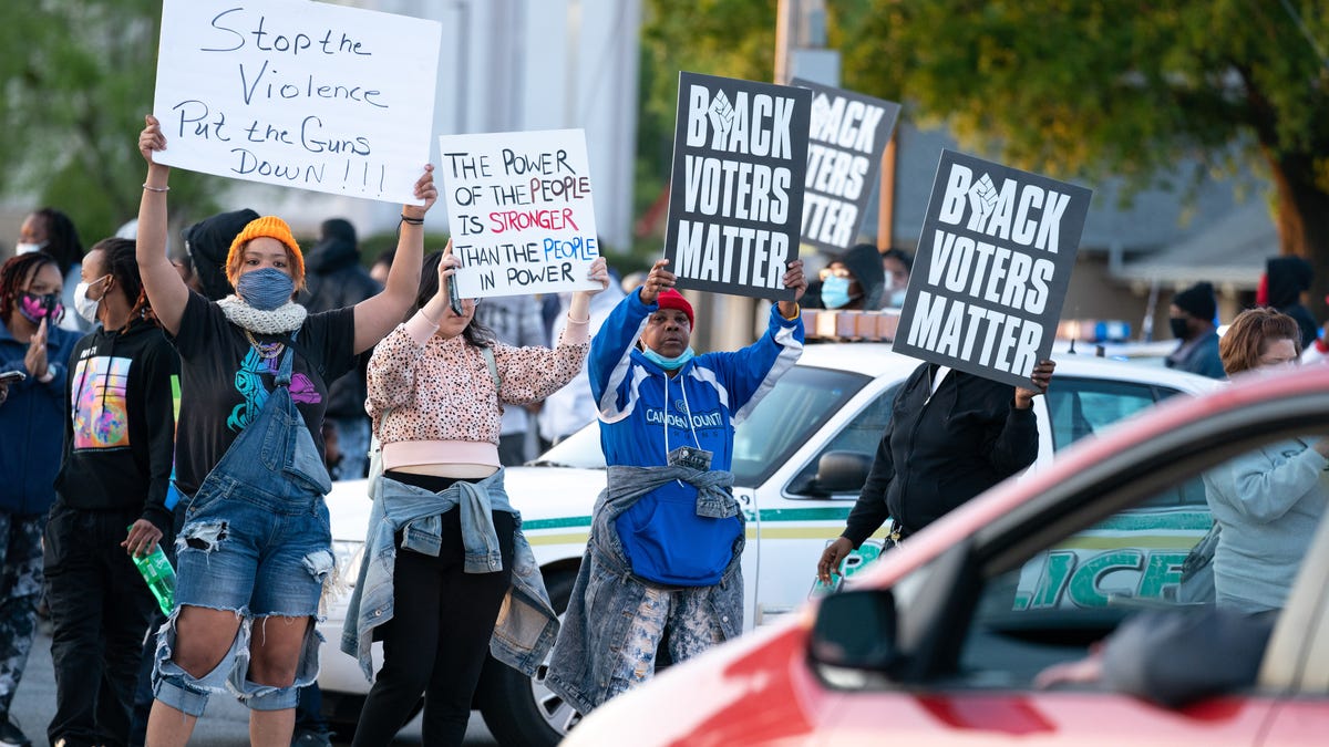 Demonstrators block an intersection during a protest march on April 22, 2021 in Elizabeth City, North Carolina. The protest was sparked by the police killing of Andrew Brown Jr. on April 21. 