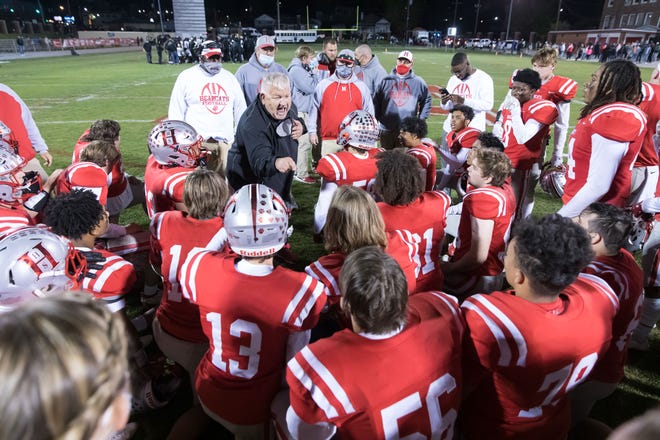 Hendersonville coach Jim Sosebee gives a postgame speech to his players in the spring of 2021 after they defeated Shelby in the state quarterfinals.