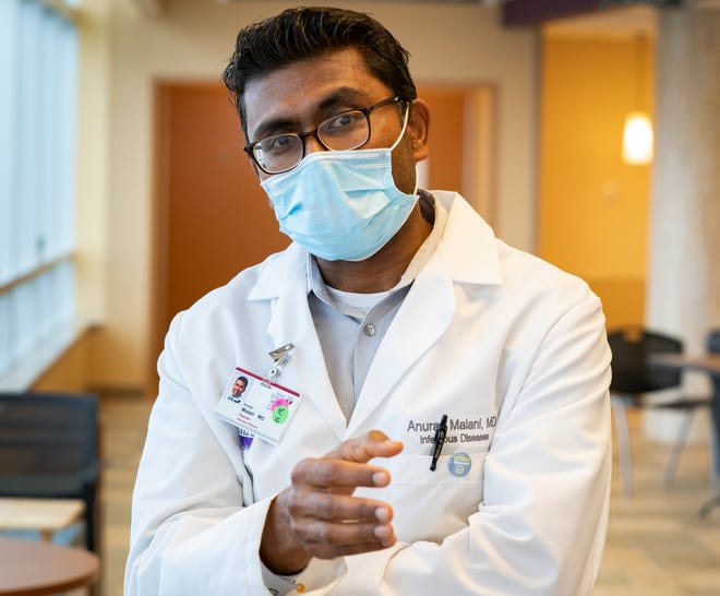 Dr. Anurag Malani, director of infection prevention for the St. Joseph Mercy Health System, speaks to a reporter before entering the COVID-19 unit at St. Joseph Mercy Hospital in Ypsilanti on Tuesday, April 20, 2021.