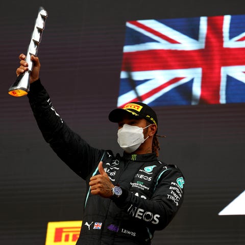 Lewis Hamilton celebrates his podium finish in the