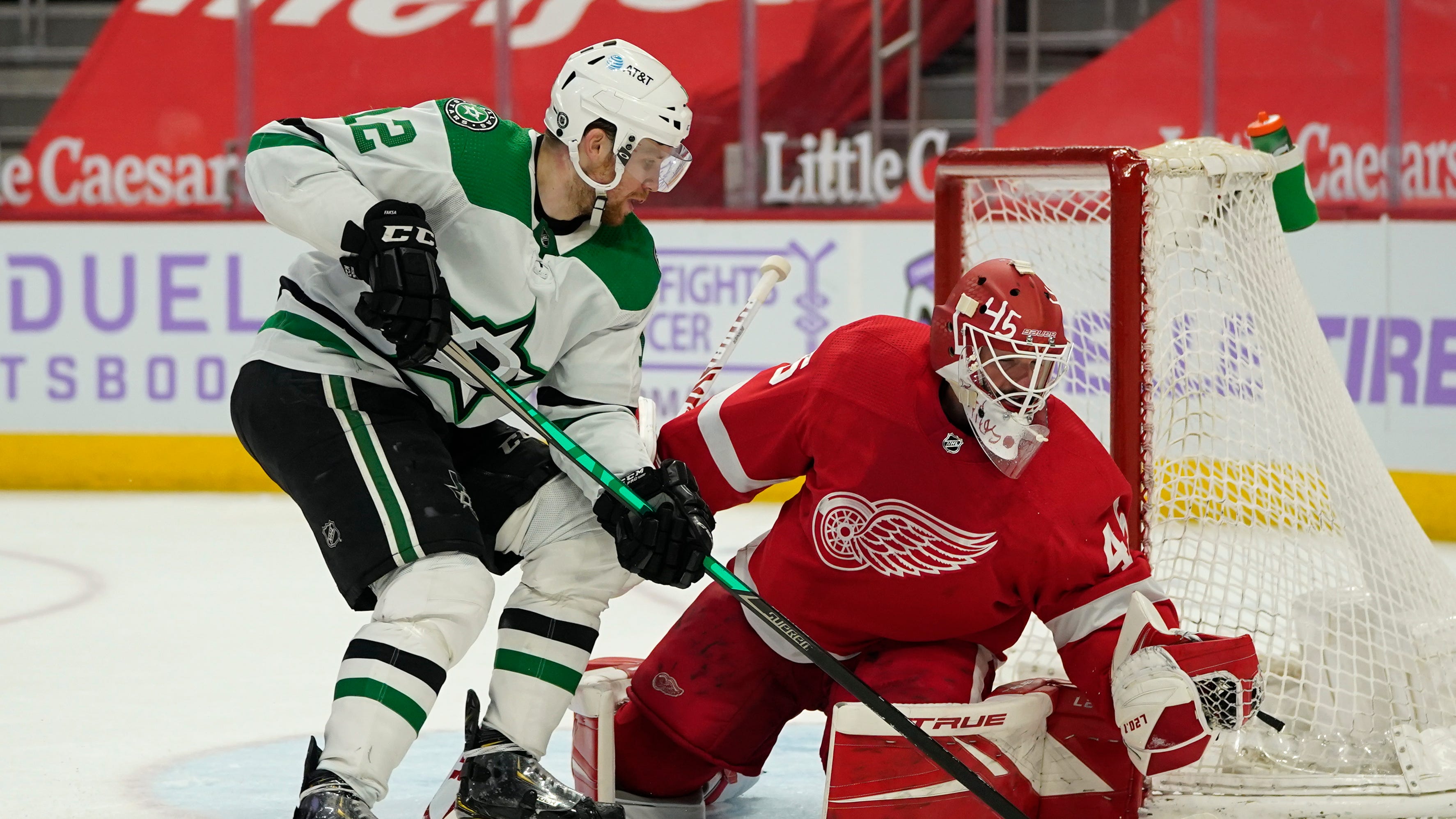 Detroit Red Wings goaltender Jonathan Bernier (45) stops a Dallas Stars center Radek Faksa (12) shot in the third period of an NHL hockey game Saturday, April 24, 2021, in Detroit.