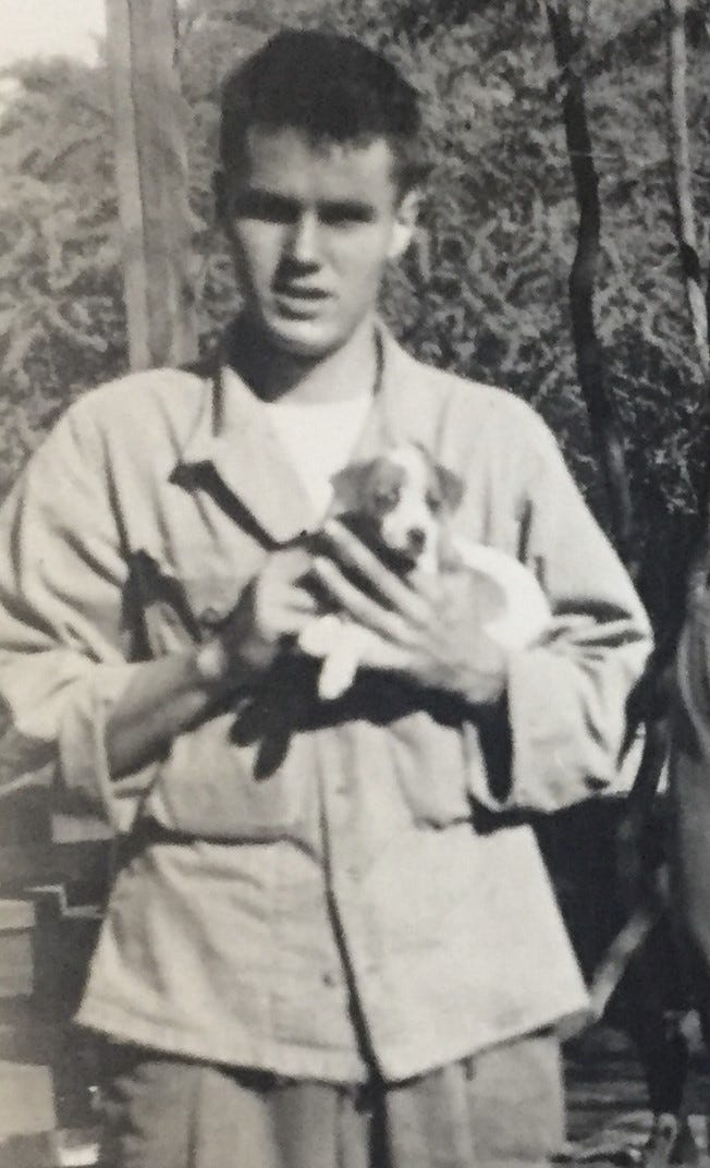 Johnny Baynes holds a puppy during the occupation of Japan in 1945.