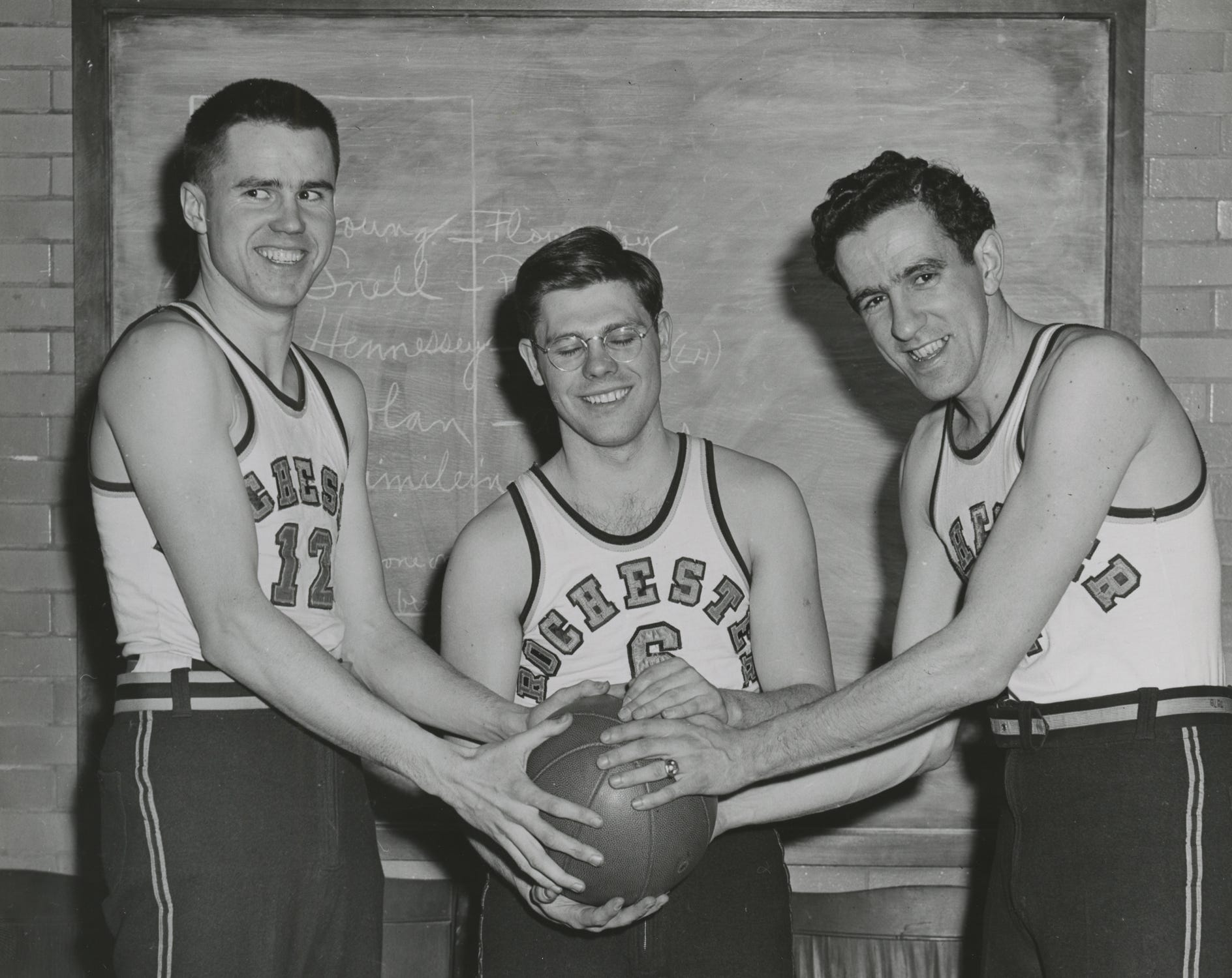 University of Rochester basketball players Johnny Baynes (left), Richard Baldwin (center) and Dick Baroody (right) during a 1940s photo-op.