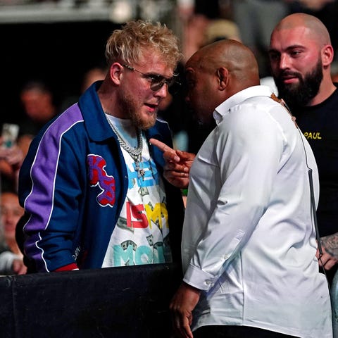 YouTube star Jake Paul, left, is confronted by UFC