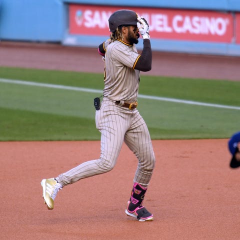 Fernando Tatis Jr. celebrates after hitting a home