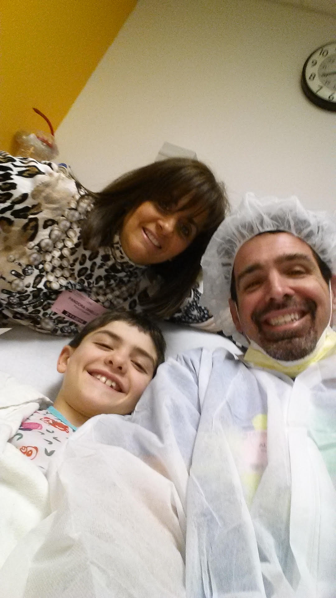 Antonio Dinello with his mother, Pandora, and his father, Al, while in the hospital in 2011.