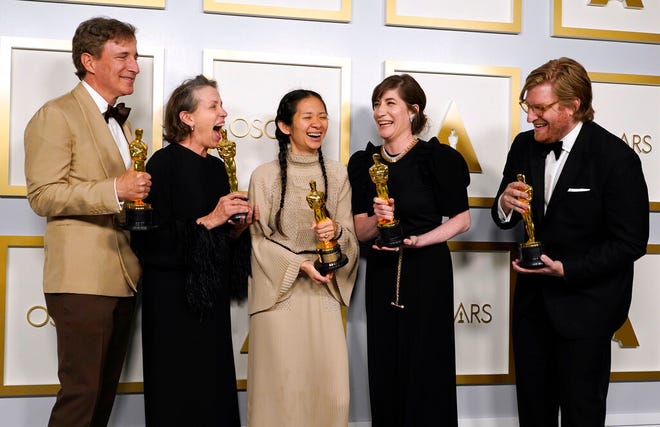 Producers Peter Spears, from left, Frances McDormand, Chloe Zhao, Mollye Asher and Dan Janvey, winners of the award for best picture for "Nomadland," pose in the press room at the Oscars on Sunday, April 25, 2021, at Union Station in Los Angeles. (AP Photo/Chris Pizzello, Pool)