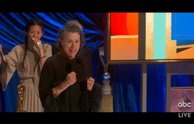 Chloe Chow, left, and Frances McDormand enthusiastically accept her best Oscar photo "Bedouin."