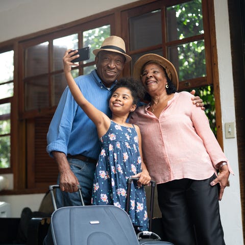 Grandparents travel with their grandchild.