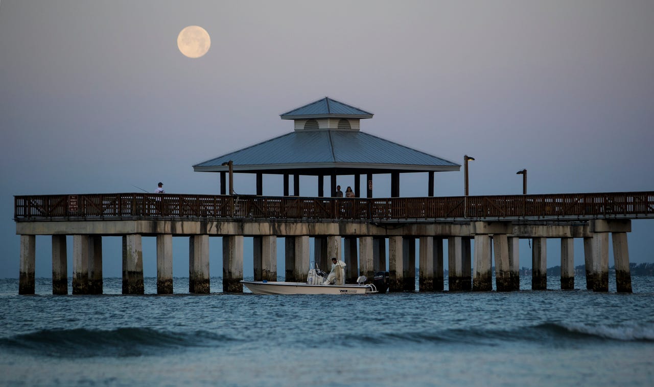 Watch a time lapse video of the 'pink' super moon setting ...