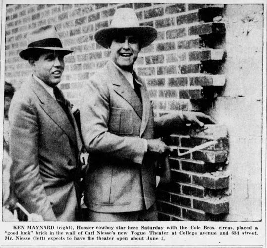 Ken Maynard, "Hoosier cowboy star" (right) placed a "good luck" brick in the wall of the Vogue Theater, alongside Carl Niesse (left). May 10, 1938