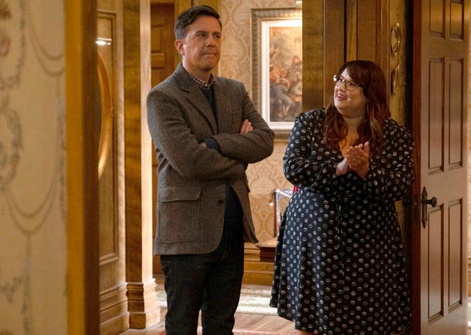 This image released by Peacock shows Ed Helms as Nathan Rutherford, left, and Jana Schmieding as Reagan Wells in a scene from the comedy series "Rutherford Falls." (Colleen Hayes/Peacock via AP)
