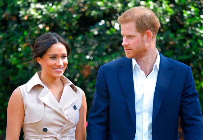 FILE - In this Oct. 2, 2019, file photo, Britain's Prince Harry and Meghan Markle appear at the Creative Industries and Business Reception at the British High Commissioner's residence in Johannesburg. Their first Netflix series will center on the Invictus Games, which gives sick and injured military personnel and veterans the opportunity to compete in sports. The Duke and Duchess of Sussexâ€™s Archewell Productions announced Tuesday its first series to hit the streaming service. (Dominic Lipinski/Pool via AP, File)