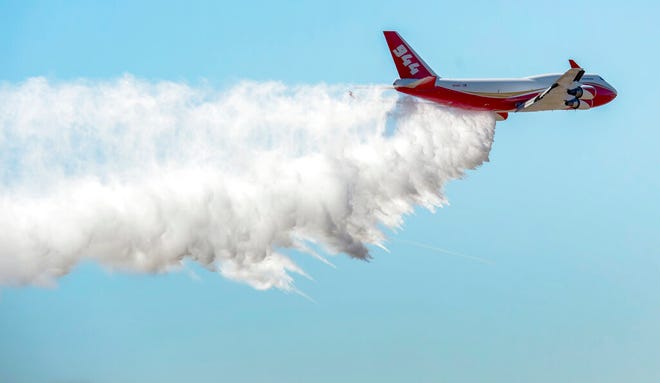 FILE - In this May 5, 2016, file photo, a Boeing 747-400 Global SuperTanker drops half a load of its 19,400-gallon capacity during a ceremony at Colorado Springs, Colo. The worldâ€™s largest firefighting plane has been shut down just as Western states prepare for a wildfire season that fire officials fear could be worse than the average year. Tara Lee, a spokeswoman for Washington Gov. Jay Inslee, said via email Friday, April 23, 2021, that the stateâ€™s Department of Natural Resources was alerted to the shutdown of the worldsâ€™ largest firefighting plane called the Global SuperTanker.(Christian Murdock/The Gazette via AP, File)