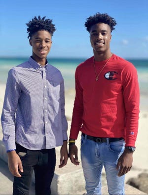John Carroll Catholic High School wide receiver Prince Strachan (left) with his brother, Michael Strachan, a wide receiver at the University of Charleston.