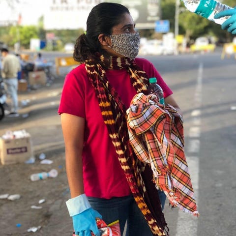 Pooja Iyengar in Bhopal, India, helps get supplies