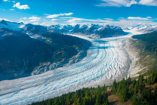 This September 2017 photo provided by researcher Brian Menounos shows the Klinaklini glacier in British Columbia, Canada. The glacier and the adjacent icefield has lost nearly 16 billion tons of snow and ice since 2000, Menounos says.