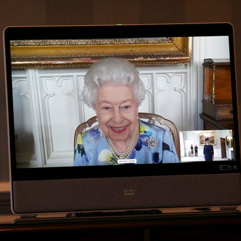 Queen Elizabeth II appears on a screen by videolin