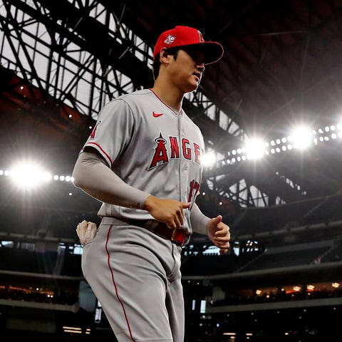 Shohei Ohtani warms up before a game against the R