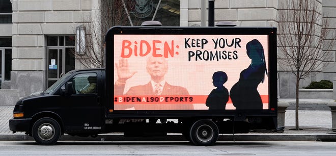 An L.E.D. truck displaying messages expressing concern over the continuing mass deportations of Black immigrants drives past the office of U.S. Customs and Border Protection prior to a #BidenAlsoDeports rally on February 15, 2021, in Washington, DC..