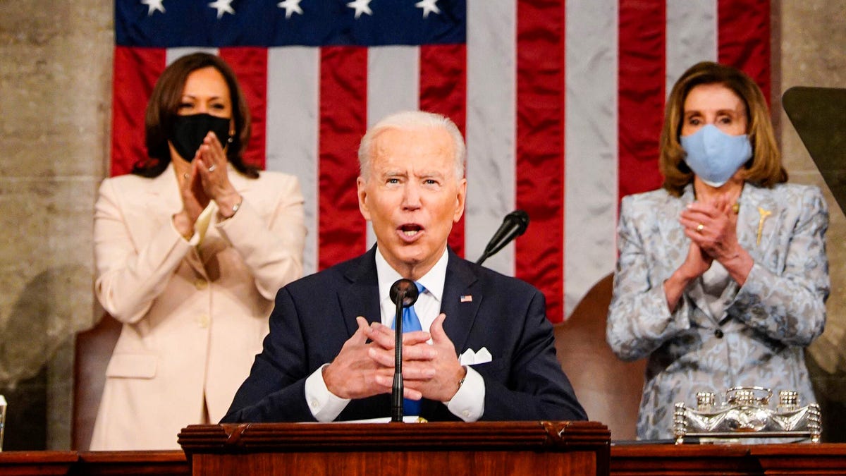 President Joe Biden, with Vice President Kamala Harris and House Speaker Nancy Pelosi, addresses a joint session of Congress on April 28, 2021.