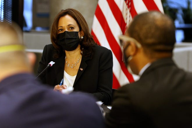 Vice President Kamala Harris listens as Urban League of Greater Southern Ohio CEO Eddie Koen speaks during a transportation round table on April 30 at the University of Cincinnati.