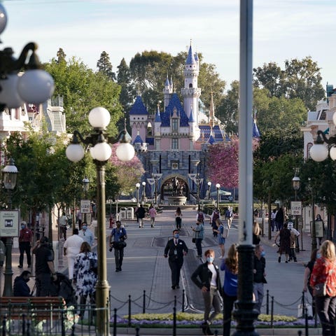 Disneyland cast members walk around Disneyland on 