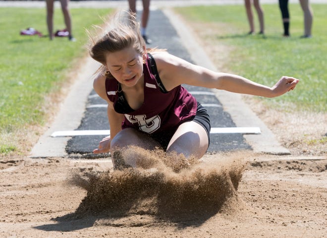 Henderson County’s Hayden Tichenor competes in the long jump during the Henderson County Invitational at Colonel Stadium Saturday morning, May 1, 2021. 