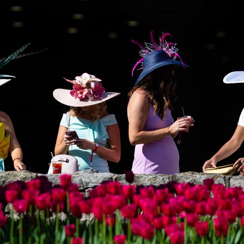 Derby goers pause for a drink before the 147th run
