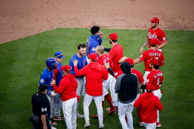 The benches clear after Cincinnati Reds relief pitcher Amir Garrett (50) struck out Chicago Cubs first baseman Anthony Rizzo (44) in the eighth inning of the baseball game against the Chicago Cubs, Saturday, May 1, 2021, at Great American Ball Park in Cincinnati.