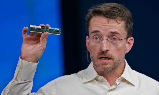 Patrick Gelsinger, now CEO of Intel Corp., holds up a chip at the Intel Developer Forum in San Francisco, in this 2008 file photo.