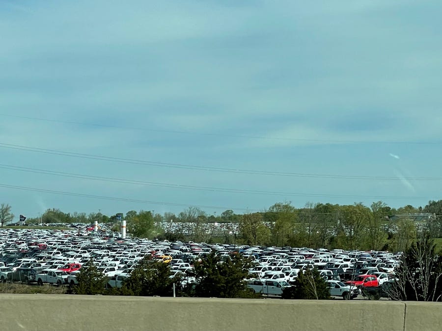 Thousands of pickup trucks could be seen from I-71 in Sparta, Kentucky on Sunday, May 2, 2021. Ford Motor Co. had approximately 22,000 vehicles at the end of March primarily in North America awaiting installation of chip related components, Chief Financial Officer John Lawler said during a first quarter earnings call with analysts on April 28, 2021. These appear to be Super Duty trucks, which are made by UAW members at the Kentucky Truck Assembly Plant in Louisville.