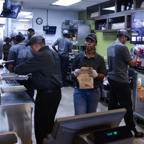 Employees prepare food at the new Taco Bell Cantin