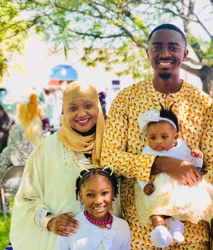 Dr. Jubril Oyeyemi and his family stand for Eid pictures at GCLEA mosque in Cherry Hill during a previous year. The family usually celebrates with barbecue food.