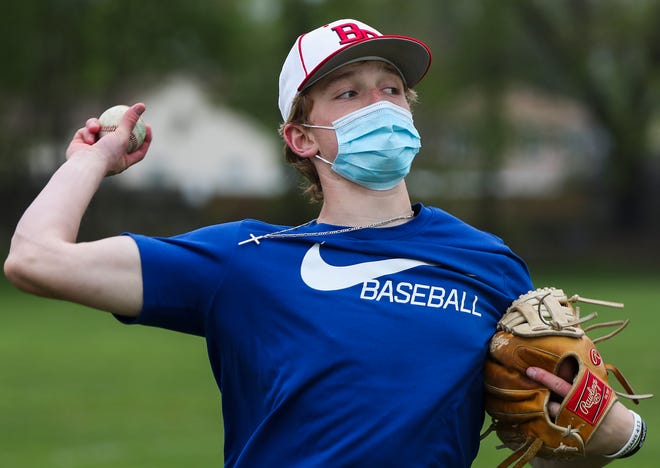 Bridgewater-Raynham Regional High School varsity baseball infielder Austin Hartsell, 17, throws during practice on Tuesday, May 4, 2021.