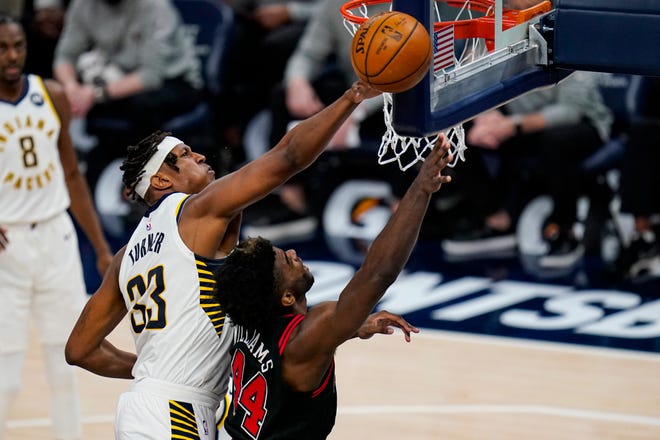 Indiana Pacers center Myles Turner (33) blocks the shot of Chicago Bulls forward Patrick Williams (44) during the second half of an NBA basketball game in Indianapolis, Tuesday, April 6, 2021. (AP Photo/Michael Conroy)
