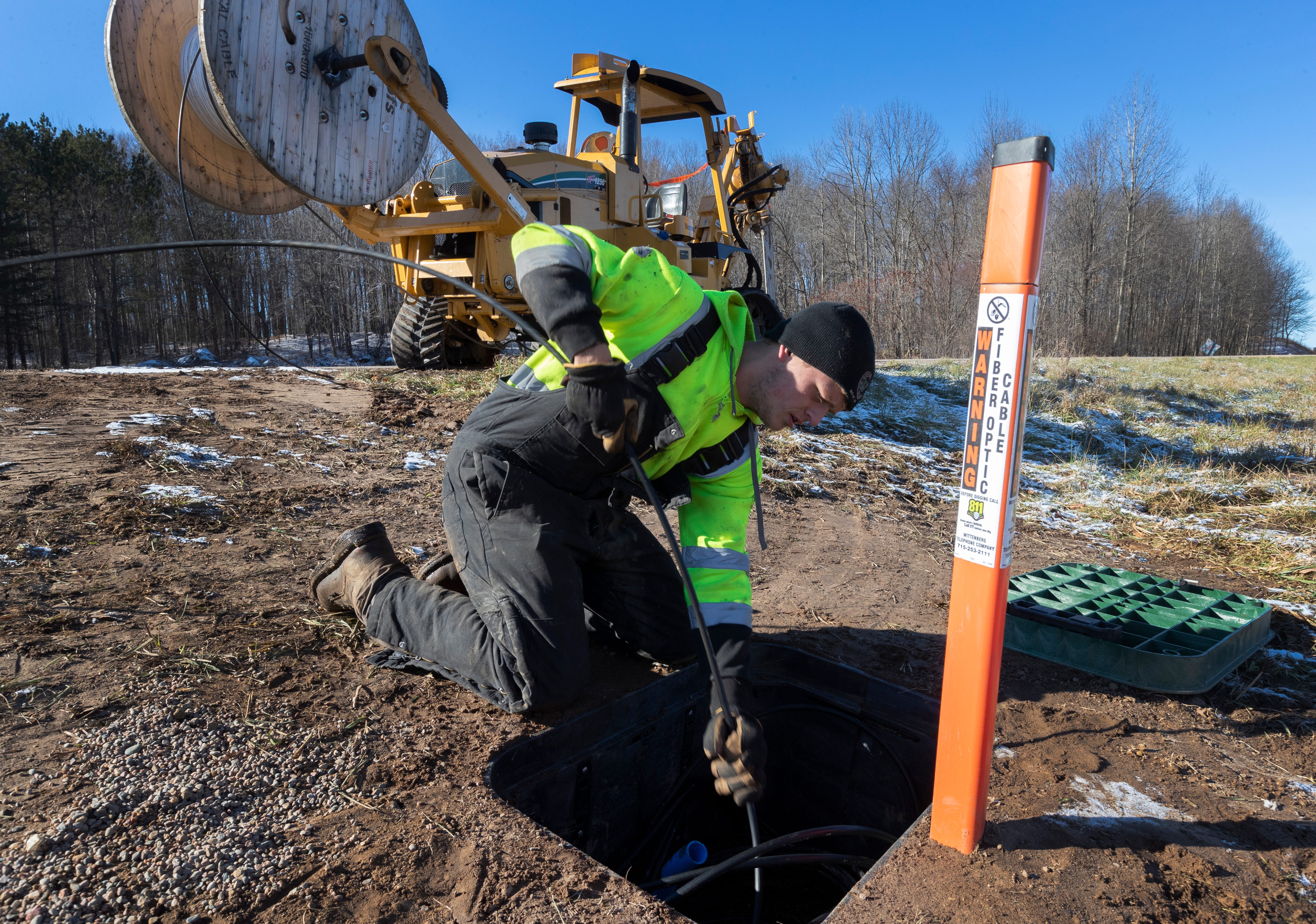 Kegan Hackbarth installs fiber-optic lines in the Shawano County village of Bowler. The Wittenberg Telephone Co. is installing hundreds of miles of fiber-optic cable in the area.