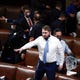Rep. Ruben Gallego, D-Ariz., stands on a chair as lawmakers prepare to evacuate the floor as rioters try to break into the House Chamber at the U.S. Capitol on Jan. 6, 2021, in Washington.