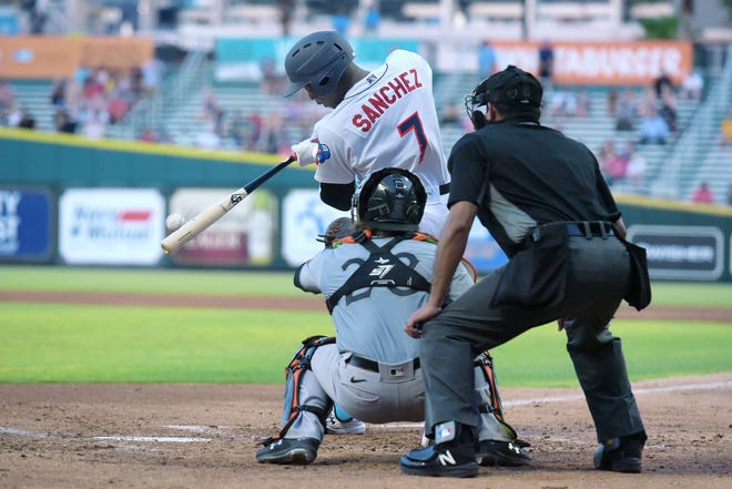 Jacksonville Jumbo Shrimp outfielder Jesus Sanchez hits the ball during a Triple-A baseball game against Norfolk.