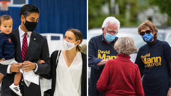 Left: Aftab Pureval with his son, Bodhi, 18 months, and wife, Dr. Whitney Whitis, prepares to submit their ballots in Clifton, May 4, 2021. At right: David Mann and his wife, Betsy, speak with voters outside of the College Hill Recreational Center.