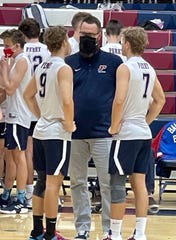 Perry High School boys volleyball coach Ryan Tolman talks to his players during a recent match.