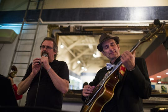 Stevie Ray Ellis (left) sings while Pete Gitlin (right) jams on the guitar during the Pita Jungle Jazz Jam April 2, 2015 in Chandler, Arizona.