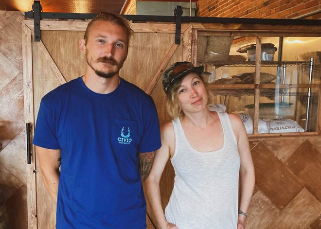 Elliot Seidler, left, and big sister Taylor Seidler putting the finishing touches on the Civic Brewing Co. in Sopchoppy this week.