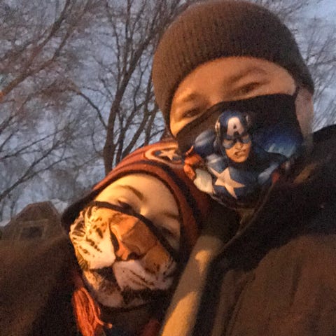 David and Nico Perry, at the bus stop, on February