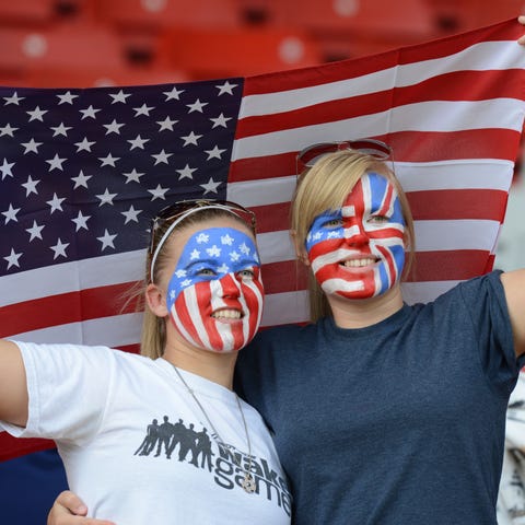 Fans of the U.S. women's soccer team hold up their
