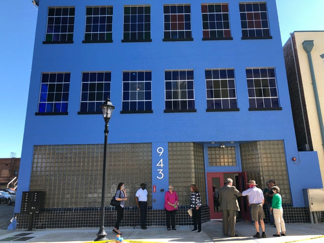 A former shirt and handkerchief factory on Ellis Street dating to the 1930s has been renovated and reopened Tuesday to house 12 market-rate apartments.