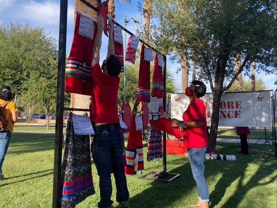 The Red Dress Project Display put up by the Phoenix Indian Center put the names of missing and murdered Indigenous people on symbolic red skirts.