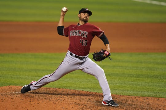 May 5, 2021; Miami, Florida, USA; Arizona Diamondbacks relief pitcher Joakim Soria (48) delivers a pitch in the 7th inning against the Miami Marlins at loanDepot park. Mandatory Credit: Jasen Vinlove-USA TODAY Sports